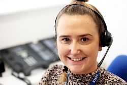 female colleague smiling with headset