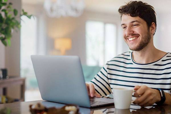 Lady using mobile tablet device smiling
