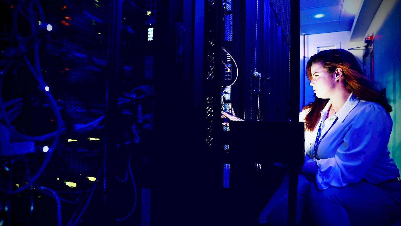 Female it professional checking server room
